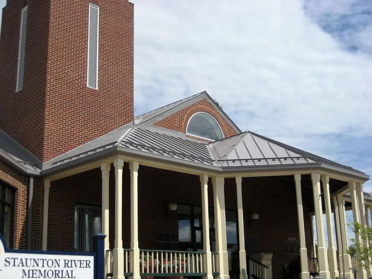 Skilled roofing craftsmen working on a residential roof in Dunkirk